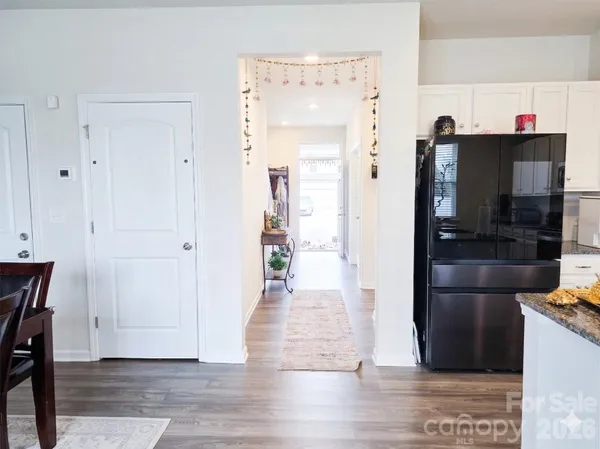 a view of a kitchen from the hallway