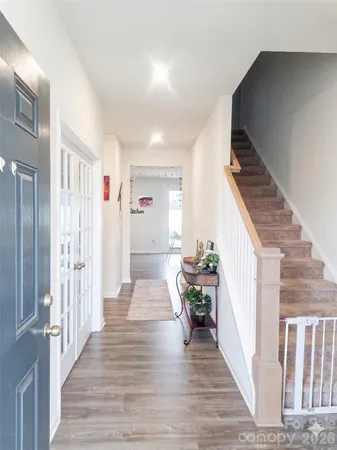 a view of entryway with wooden floor