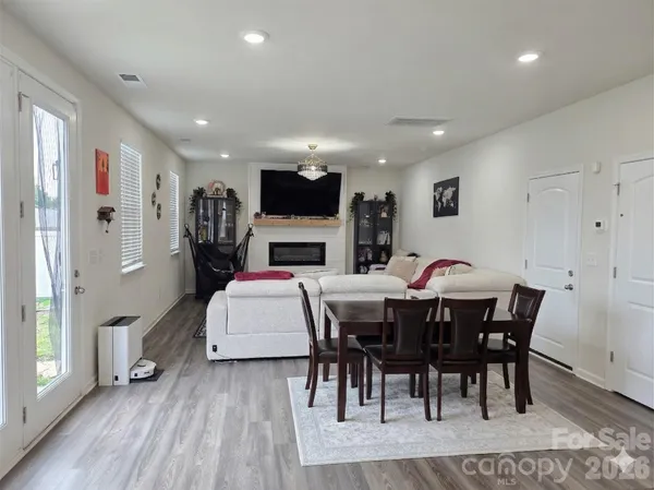 a dining room with furniture and window
