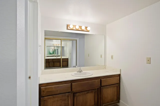 a bathroom with a sink and a mirror