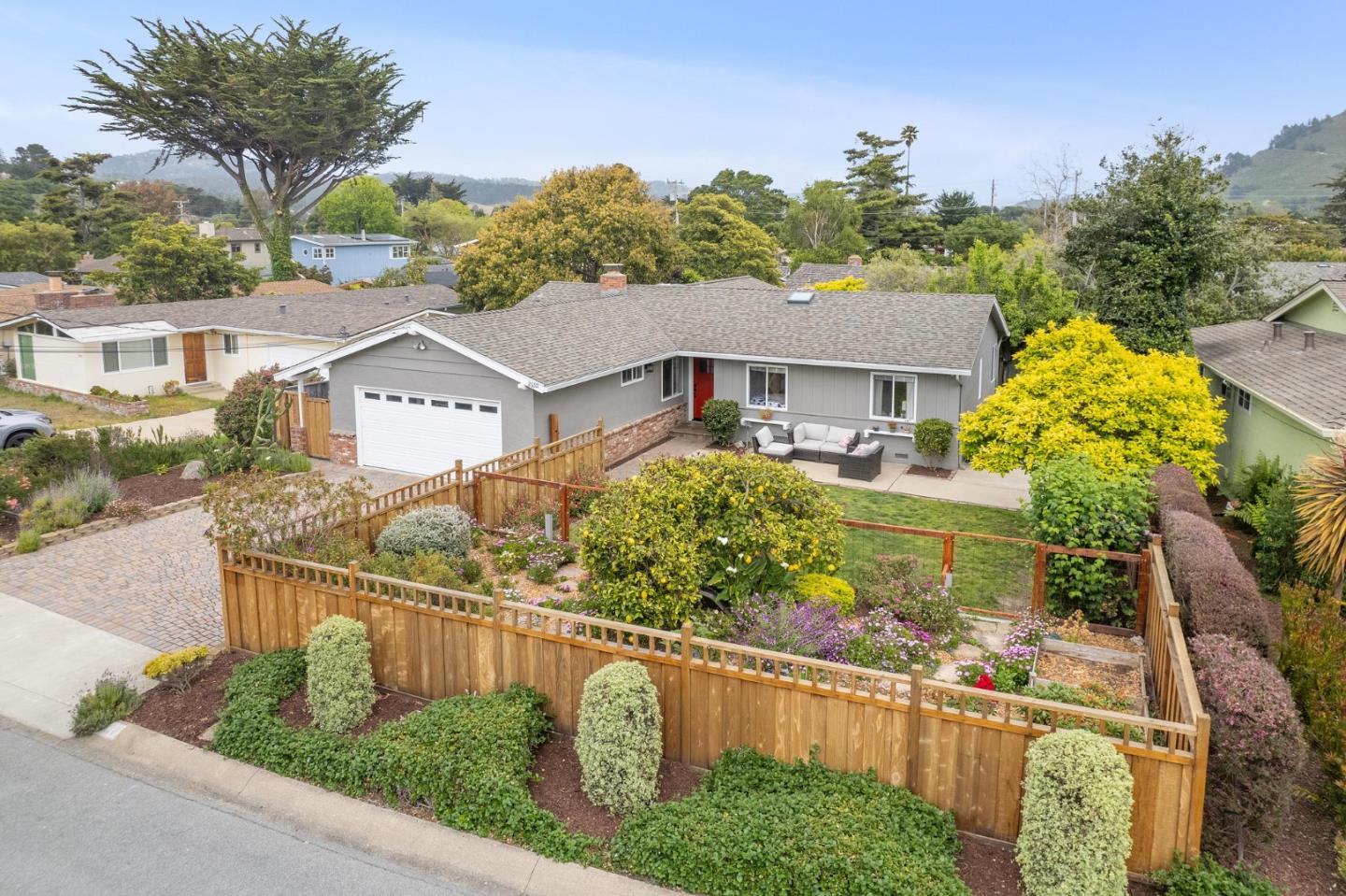 a view of a house with a yard and plants