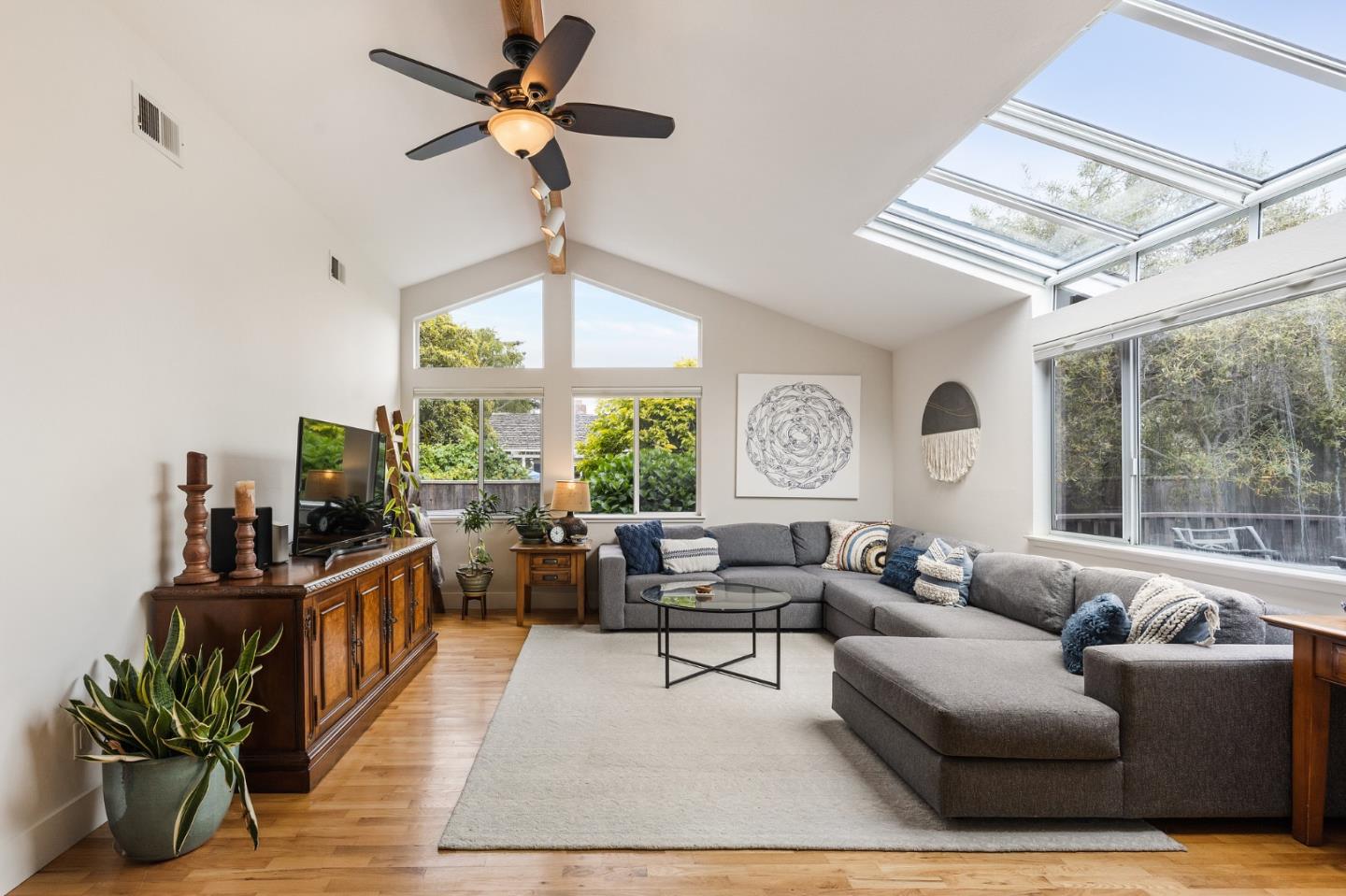 26571 Oliver Road Carmel, CA 93923 - Photo 17 of 63 a living room with furniture a chandelier and a large window