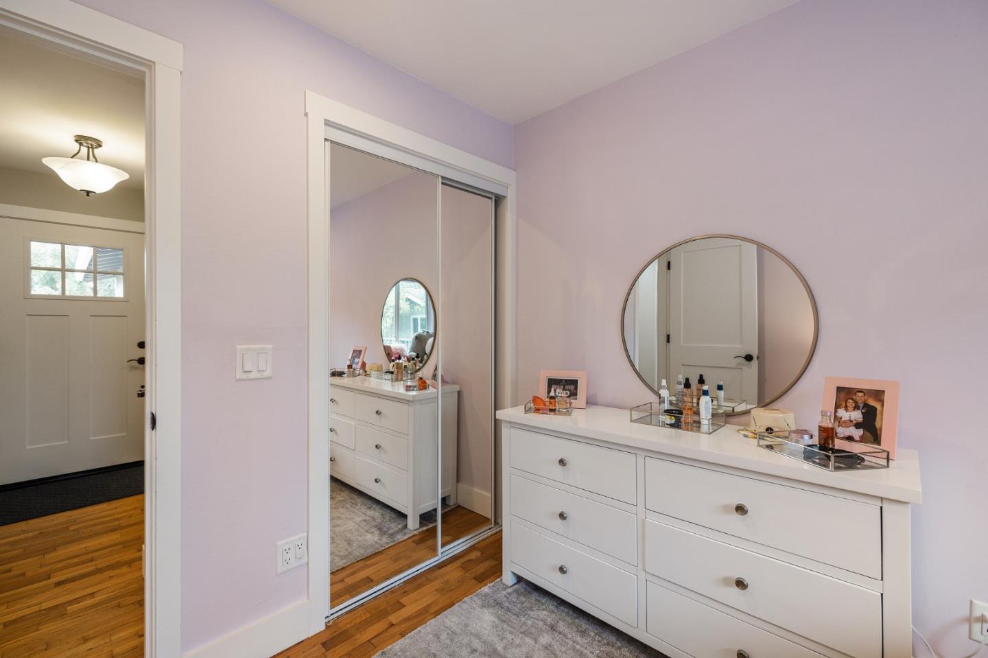 26571 Oliver Road Carmel, CA 93923 - Photo 34 of 63 a room with round mirror and cabinets