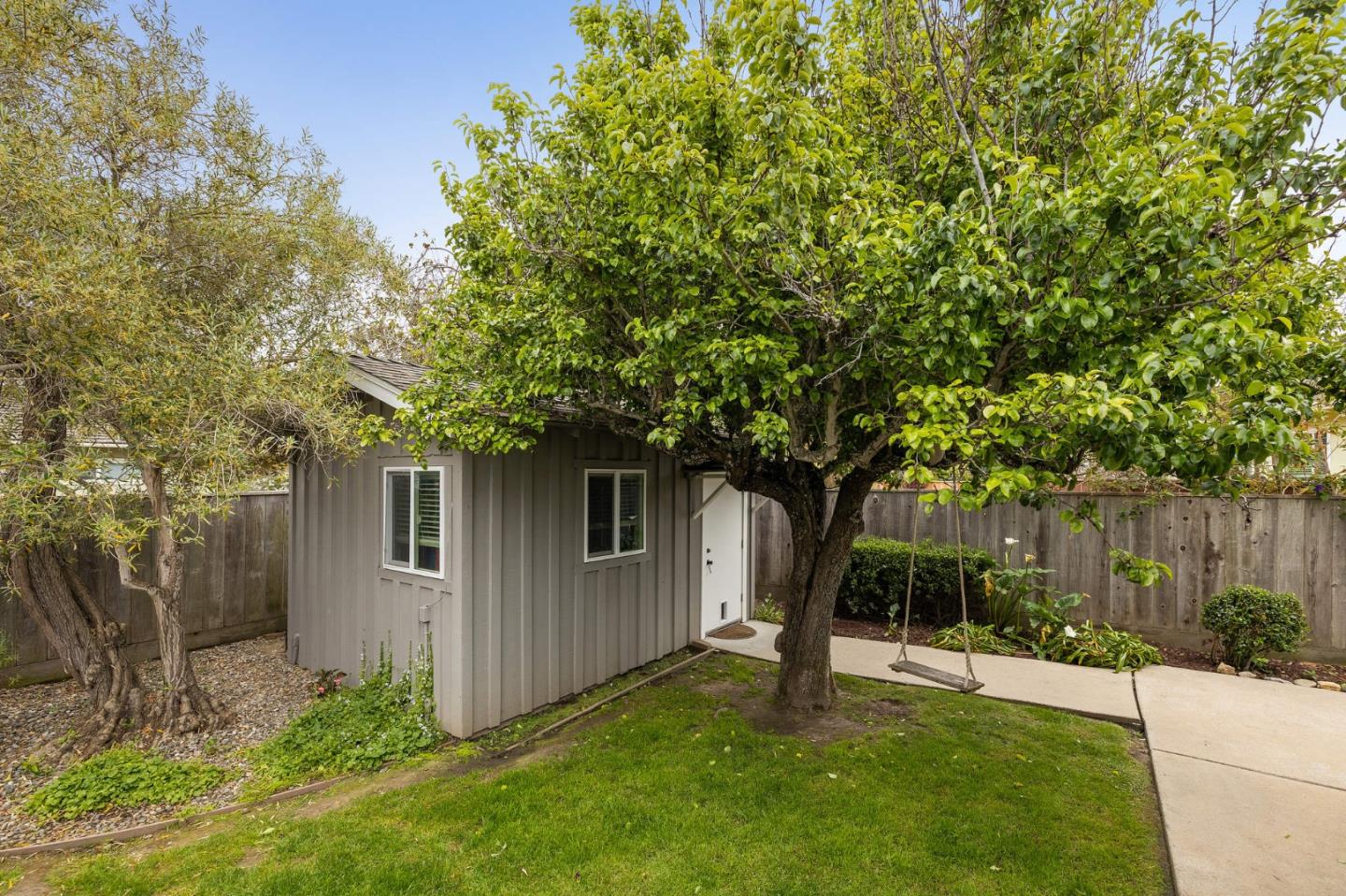 26571 Oliver Road Carmel, CA 93923 - Photo 36 of 63 a view of a backyard with plants and large tree