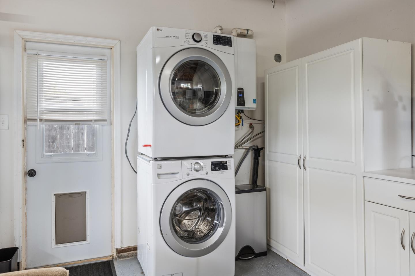26571 Oliver Road Carmel, CA 93923 - Photo 43 of 63 a utility room with dryer and washer