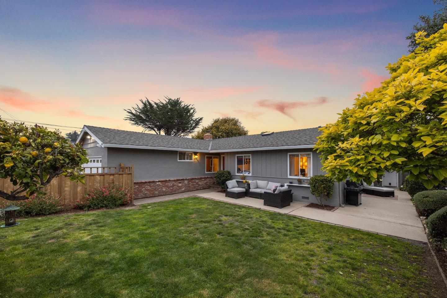 26571 Oliver Road Carmel, CA 93923 - Photo 47 of 63 a front view of a house with a garden and patio