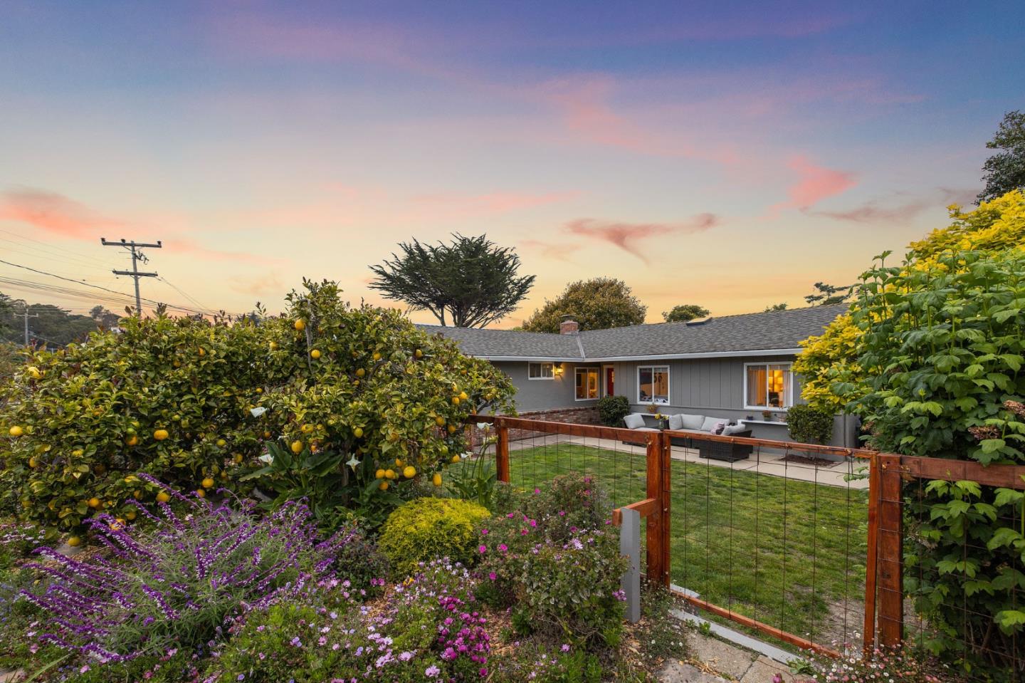 26571 Oliver Road Carmel, CA 93923 - Photo 50 of 63 a front view of a house with a yard