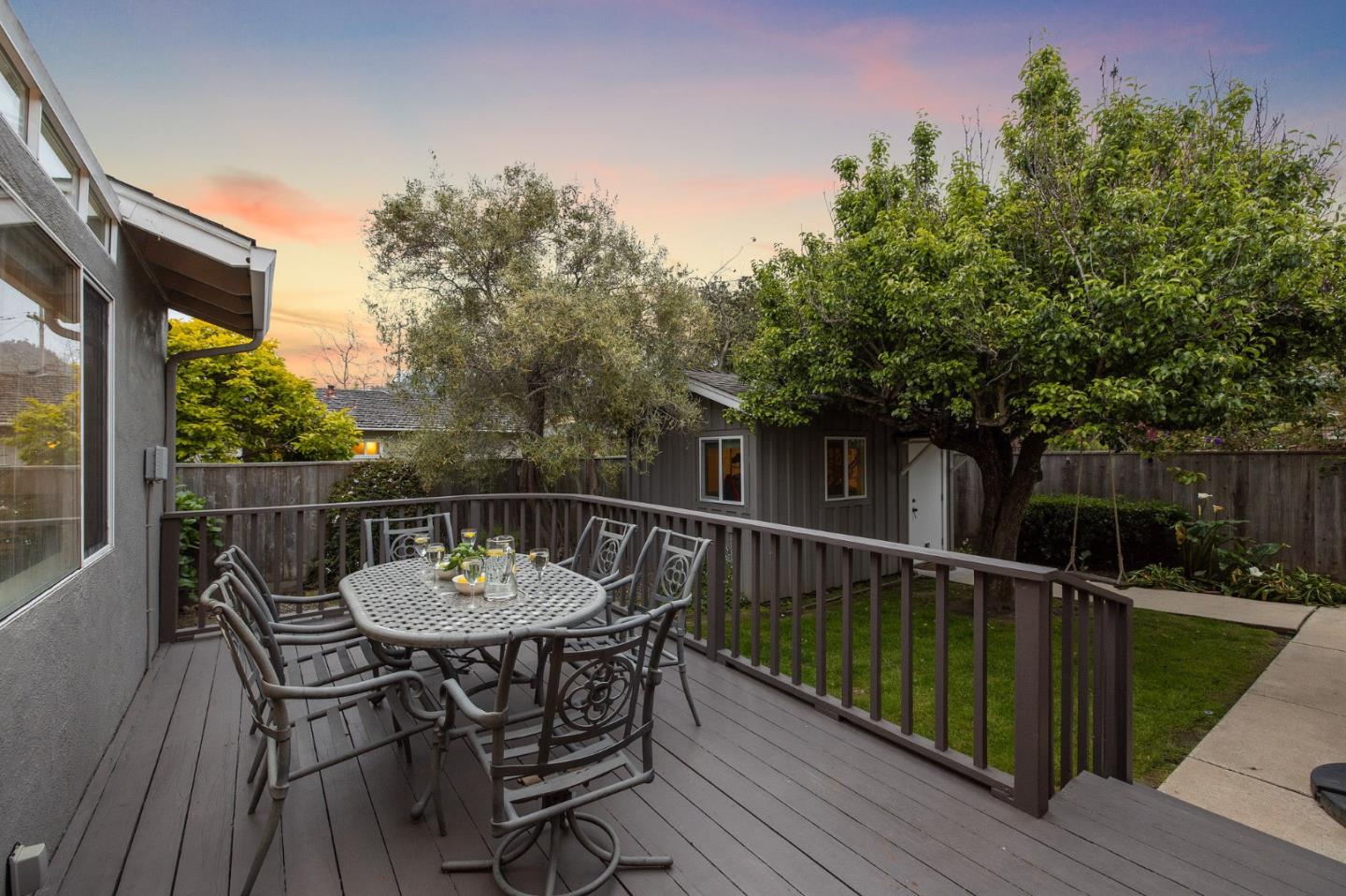 26571 Oliver Road Carmel, CA 93923 - Photo 56 of 63 a view of a roof deck with table and chairs with wooden floor and fence