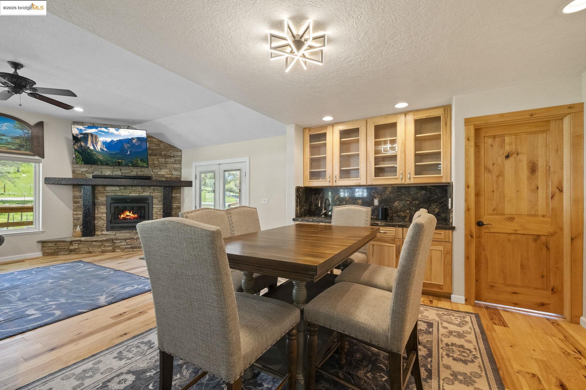 18060 Rob-Ric Road Sonora, CA 95370 - Photo 13 of 52 a view of a dining room with furniture window and wooden floor