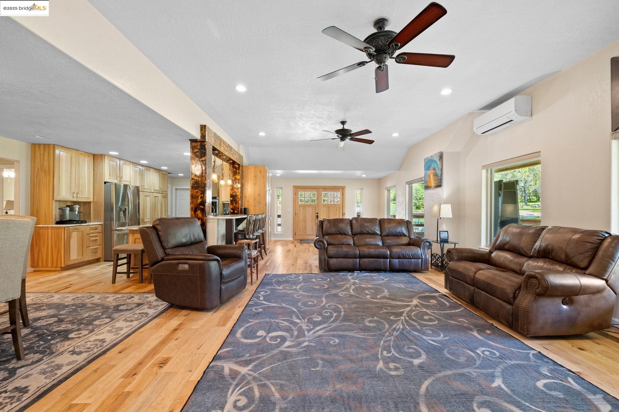 18060 Rob-Ric Road Sonora, CA 95370 - Photo 18 of 52 a living room with furniture ceiling fan and a rug