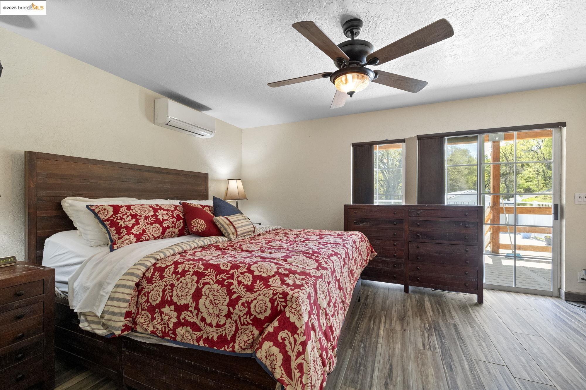 18060 Rob-Ric Road Sonora, CA 95370 - Photo 20 of 52 a bedroom with a large bed and a large window