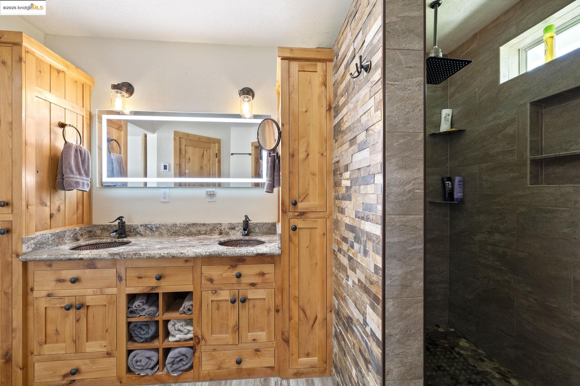 18060 Rob-Ric Road Sonora, CA 95370 - Photo 23 of 52 a view of a bathroom with a sink and a mirror