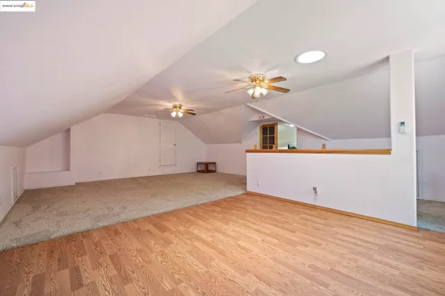 a bedroom with furniture and a wooden floor