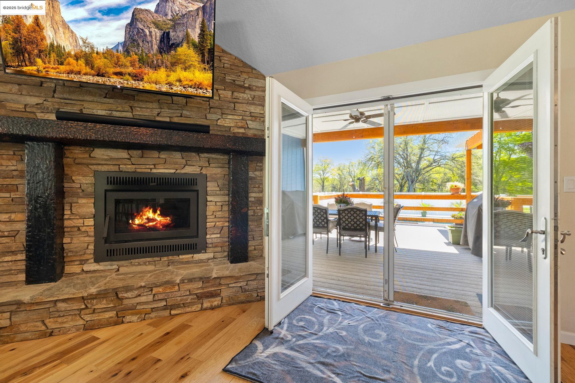 18060 Rob-Ric Road Sonora, CA 95370 - Photo 32 of 52 a living room with a fireplace and a floor