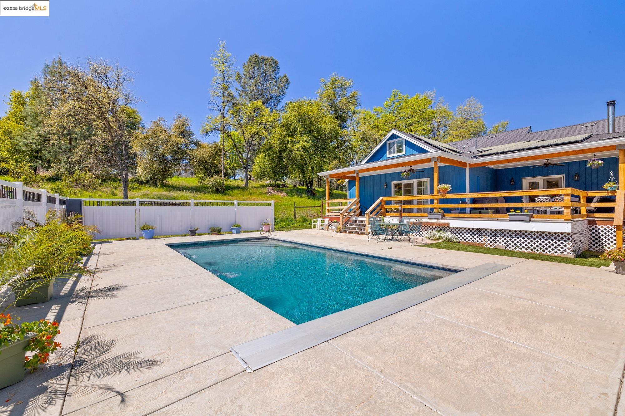 18060 Rob-Ric Road Sonora, CA 95370 - Photo 39 of 52 swimming pool view with a seating space and a garden view
