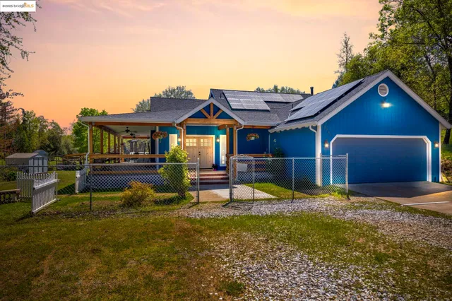 a swimming pool view with a seating space and a garden view