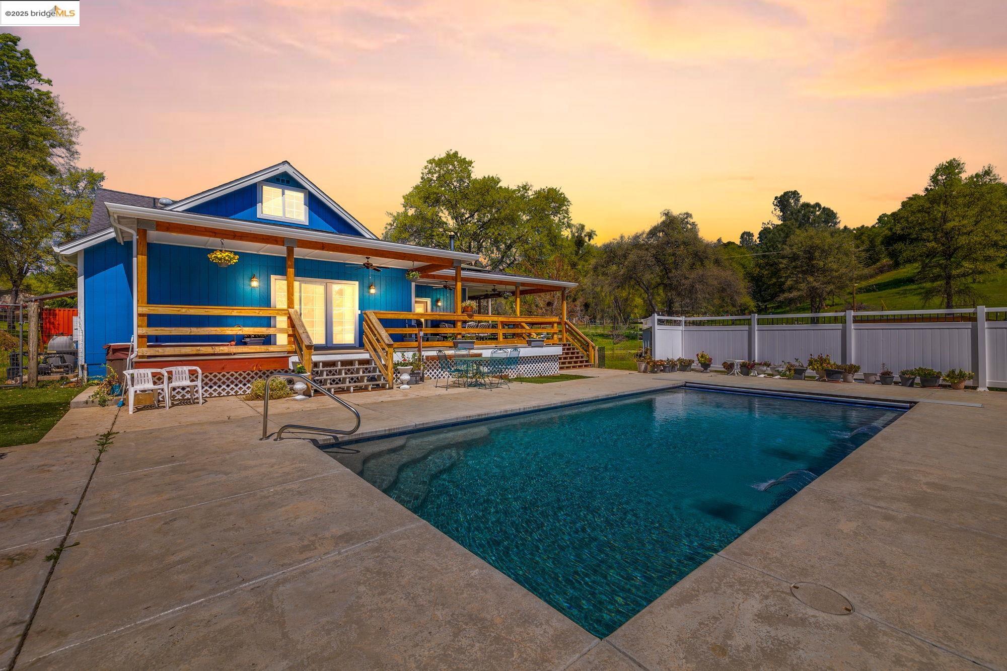 18060 Rob-Ric Road Sonora, CA 95370 - Photo 51 of 52 a view of a house with swimming pool and sitting area