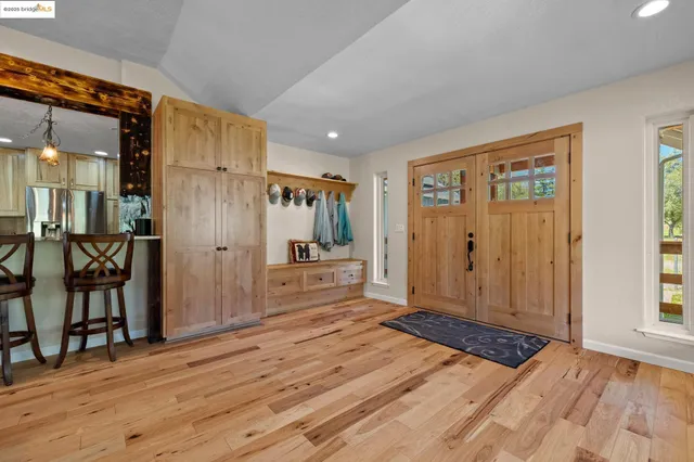 a view of a dining room with furniture window and wooden floor