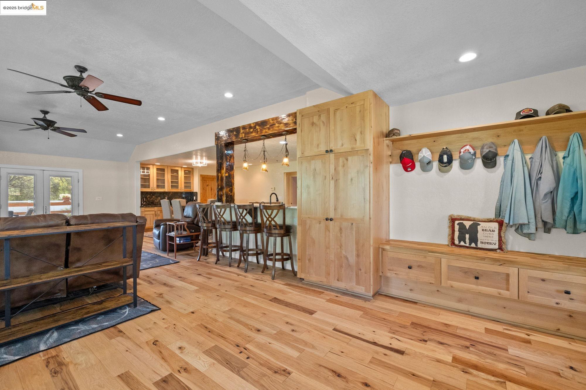 18060 Rob-Ric Road Sonora, CA 95370 - Photo 8 of 52 a room with lots of wooden furniture and a ceiling fan