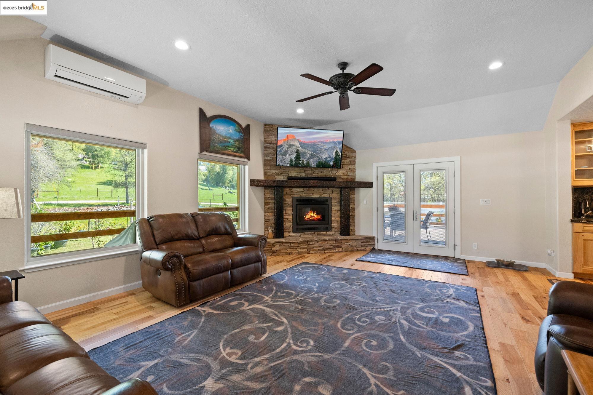 18060 Rob-Ric Road Sonora, CA 95370 - Photo 10 of 52 a living room with furniture window and a fireplace