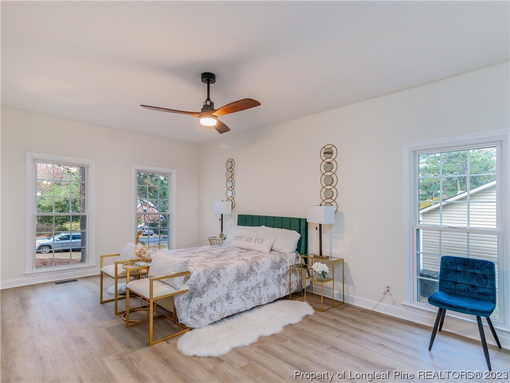 6915 South Staff Road Fayetteville, NC 28306 - Photo 13 of 23 a bedroom with a bed and a window