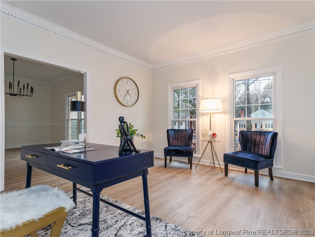6915 South Staff Road Fayetteville, NC 28306 - Photo 5 of 23 a view of a workspace with furniture and a window