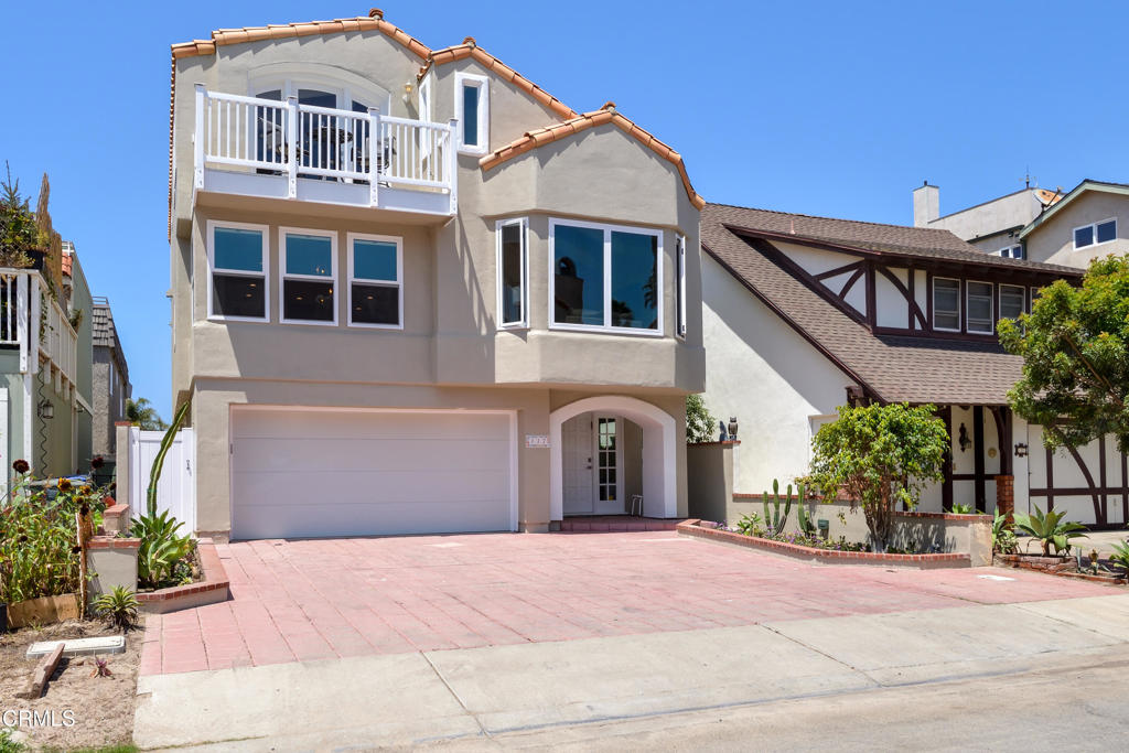 117 Santa Cruz Avenue Oxnard, CA 93035 - Photo 35 of 35 a front view of a house with a yard and a garage