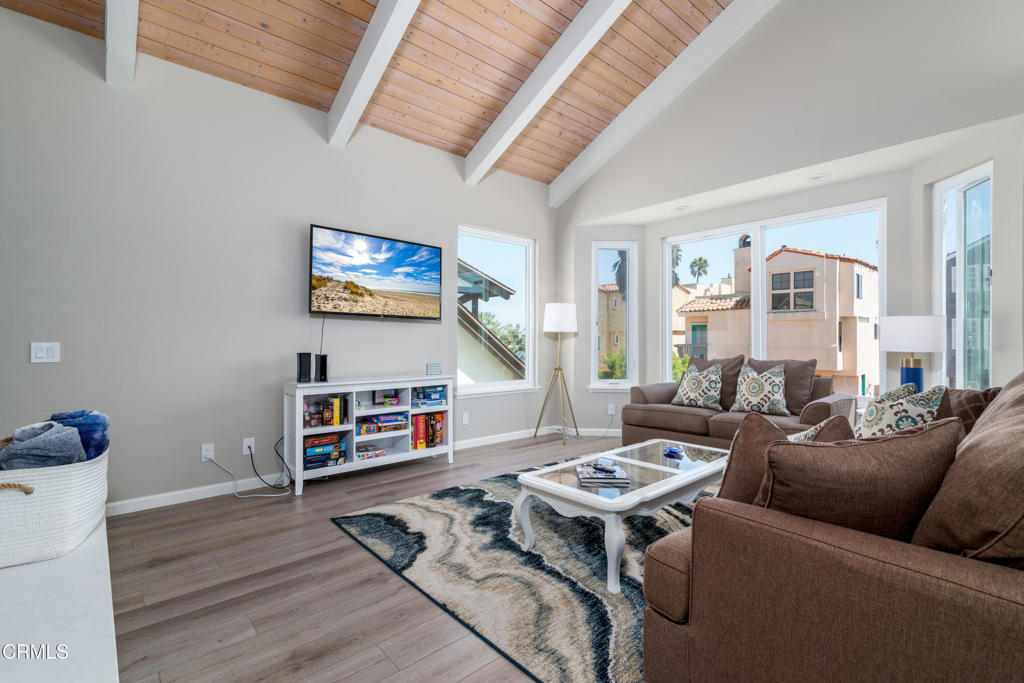 117 Santa Cruz Avenue Oxnard, CA 93035 - Photo 8 of 35 a living room with furniture and a flat screen tv with rug
