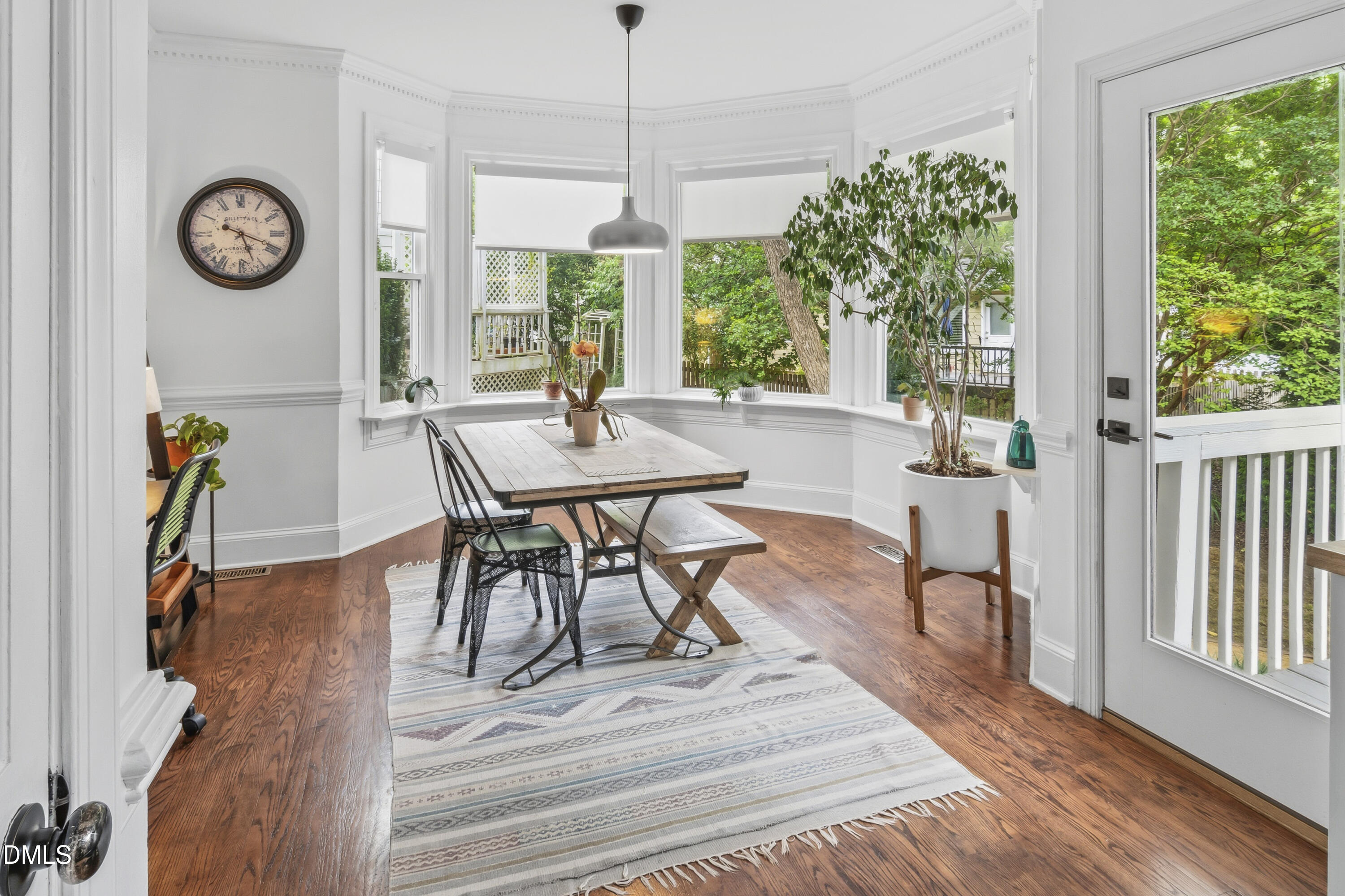 3004 West Annaley Drive Raleigh, NC 27604 - Photo 16 of 44 a view of a dining room with furniture window and wooden floor