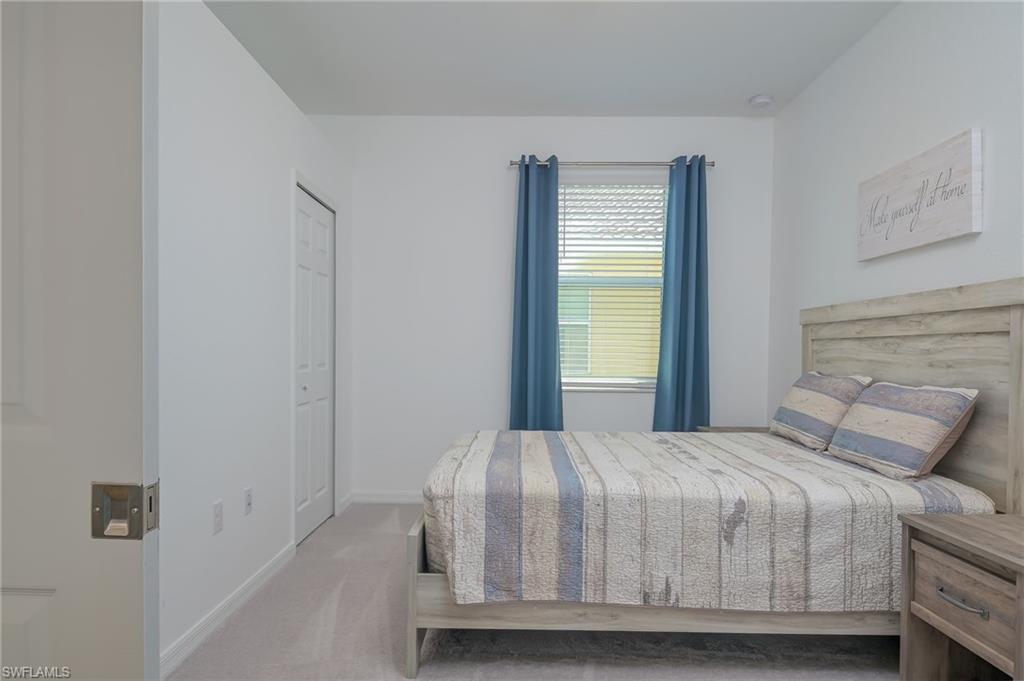 1774 Alameda Drive Naples, FL 34120 - Photo 14 of 29 a bedroom with a bed and a window