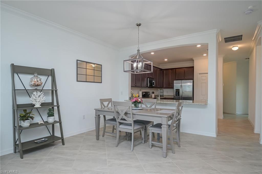1774 Alameda Drive Naples, FL 34120 - Photo 7 of 29 a view of a dining room with furniture