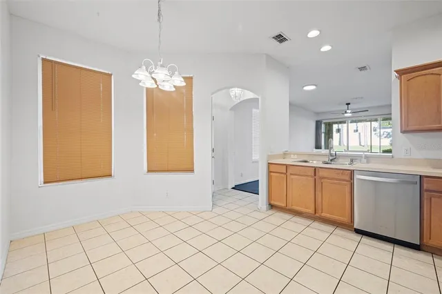 a kitchen with a sink cabinets and window