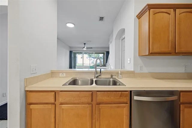 a kitchen with a sink and cabinets
