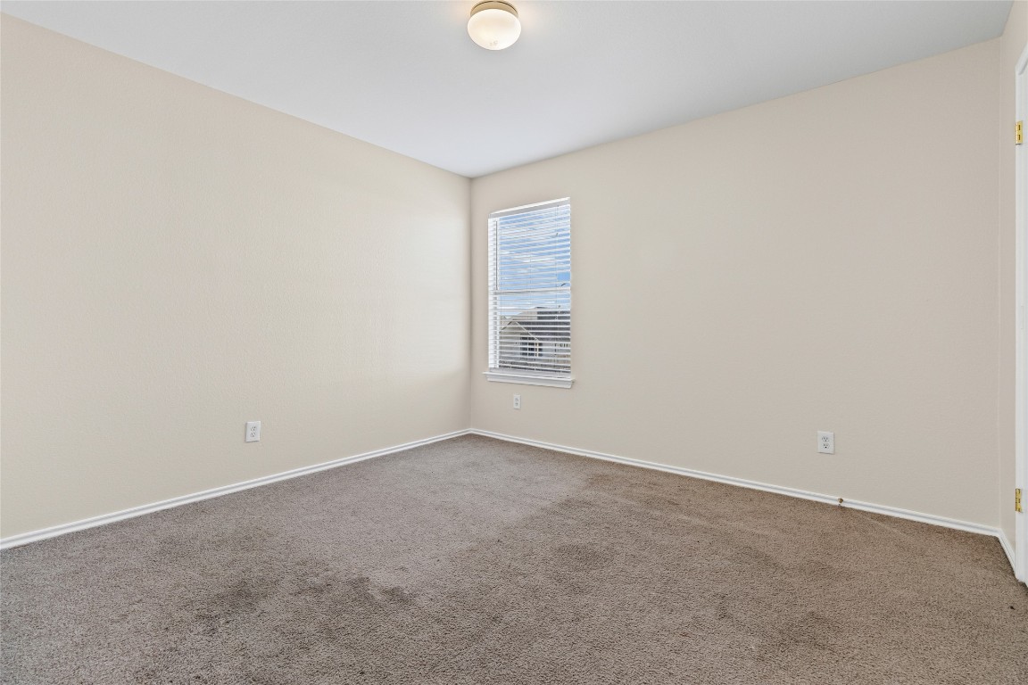 12700 St Mary Drive Manor, TX 78653 - Photo 13 of 17 a view of an empty room with a window