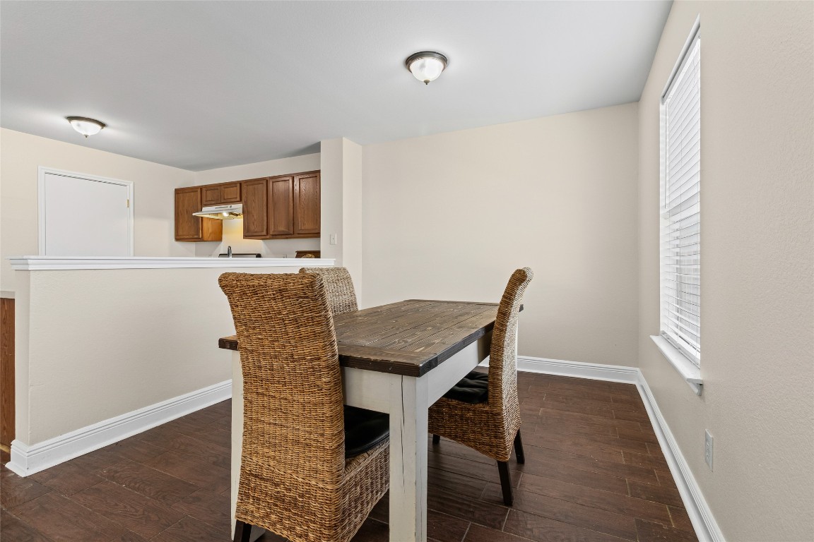 12700 St Mary Drive Manor, TX 78653 - Photo 6 of 17 a view of a dining room with furniture and wooden floor