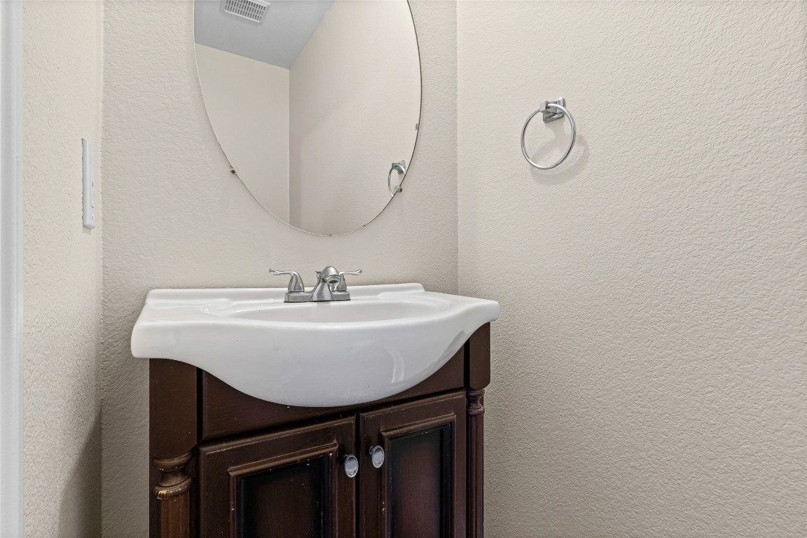 12700 St Mary Drive Manor, TX 78653 - Photo 8 of 17 a sink and a mirror in a room