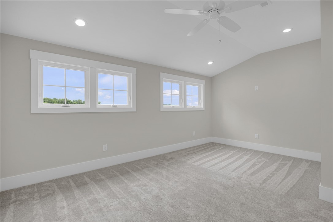 1230 Melton Road, Unit 216 West Union, SC 29696 - Photo 29 of 49 Natural light streams into this serene bedroom, highlighting the vaulted ceiling and soft carpeting.