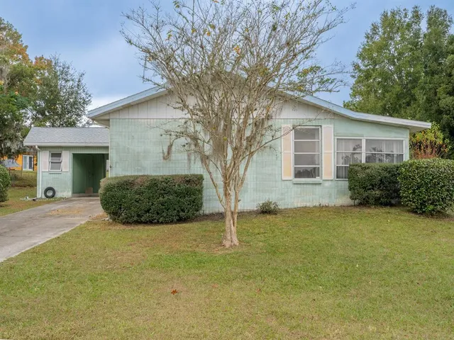 front view of a house with a yard