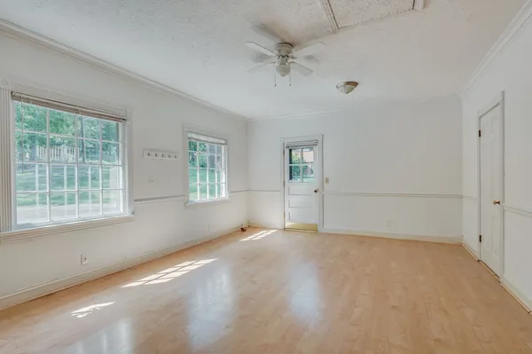 a view of an empty room with a window
