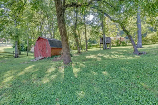 a backyard of a house with lots of green space