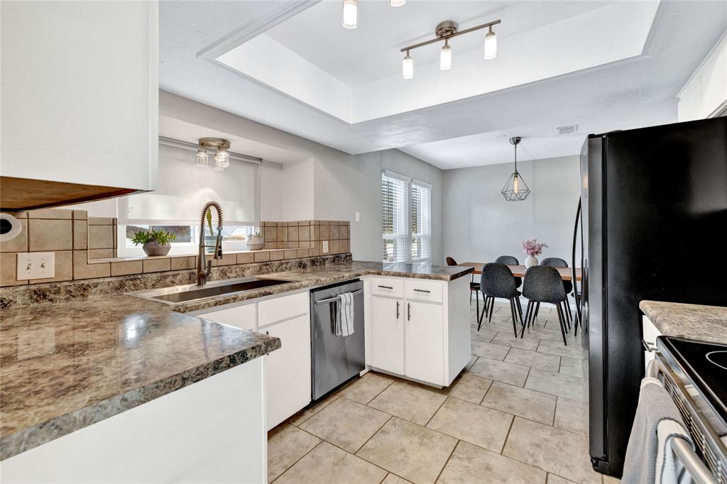 2609 Quail Ridge Irving, TX 75060 - Photo 12 of 39 a large kitchen with cabinets