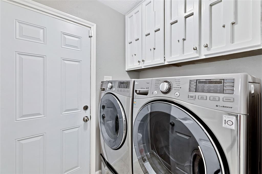 2609 Quail Ridge Irving, TX 75060 - Photo 17 of 39 a utility room with dryer and washer