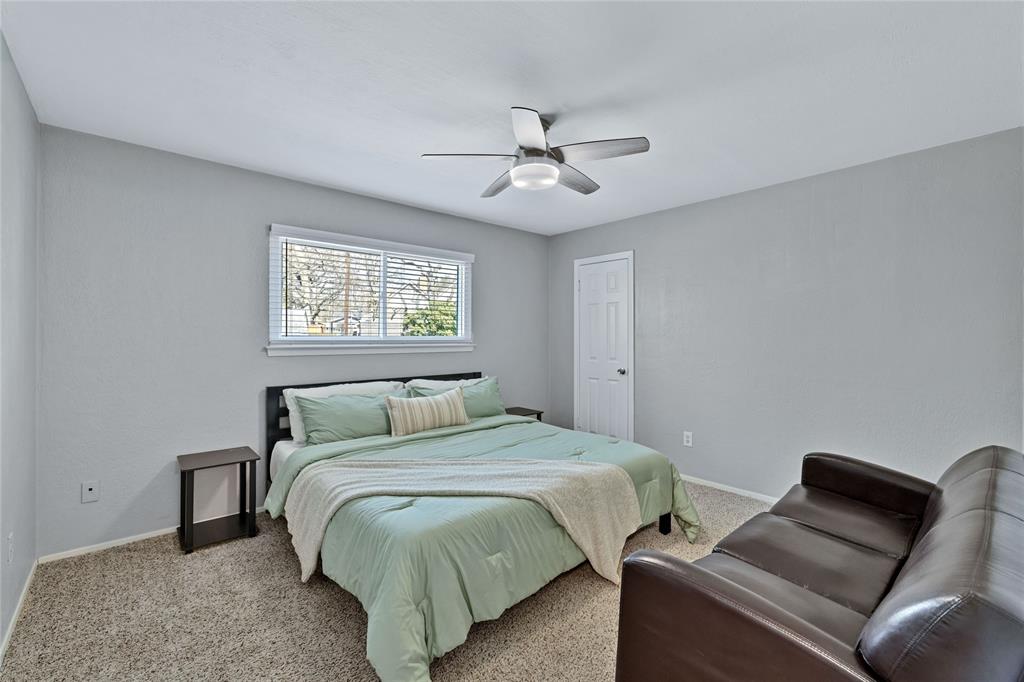 2609 Quail Ridge Irving, TX 75060 - Photo 18 of 39 a bedroom with a bed and window
