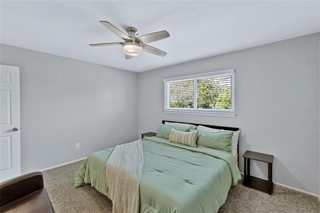 2609 Quail Ridge Irving, TX 75060 - Photo 19 of 39 a bedroom with a bed and window