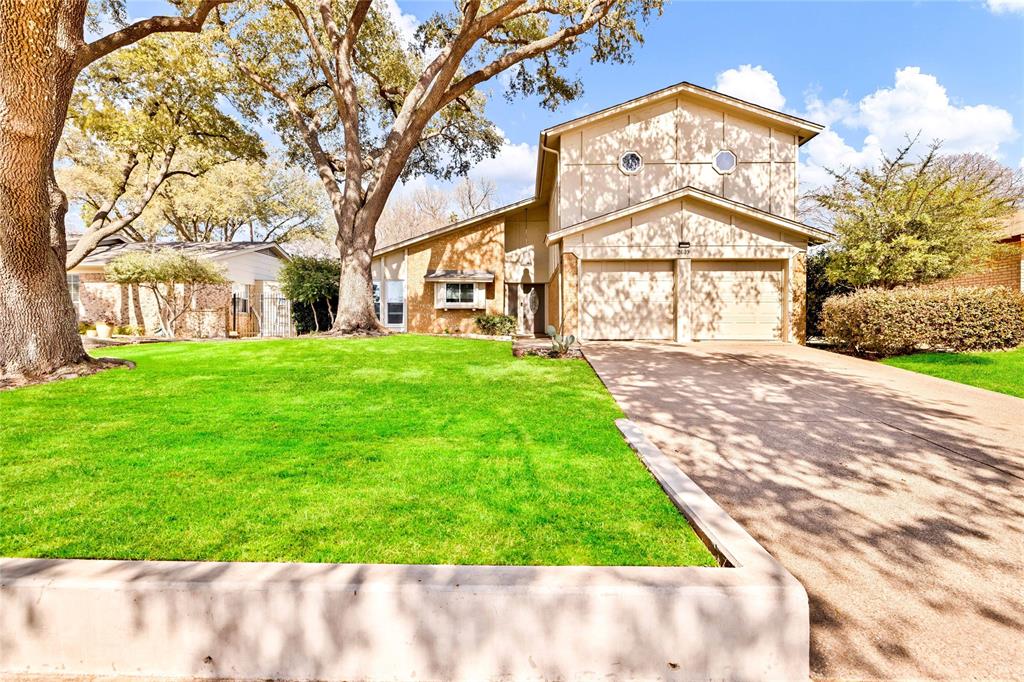 2609 Quail Ridge Irving, TX 75060 - Photo 2 of 39 a view of a big yard with large trees