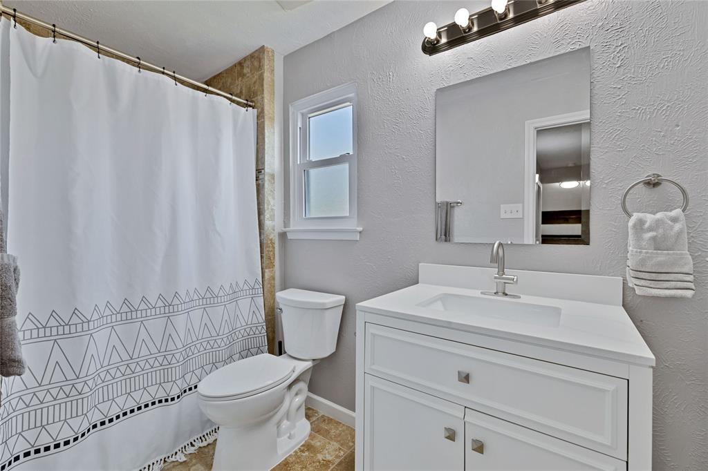 2609 Quail Ridge Irving, TX 75060 - Photo 21 of 39 a bathroom with a sink toilet and shower