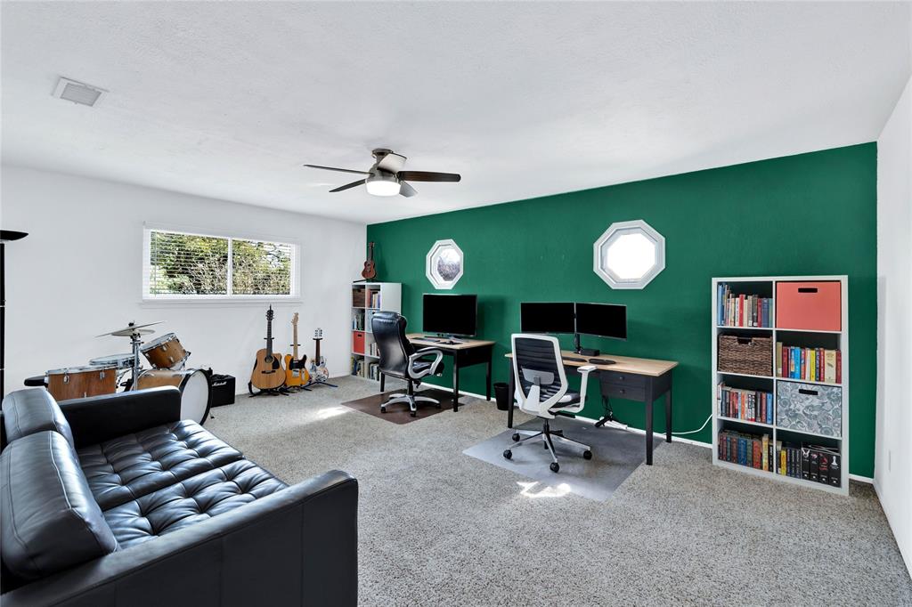 2609 Quail Ridge Irving, TX 75060 - Photo 22 of 39 a room with furniture and a fireplace