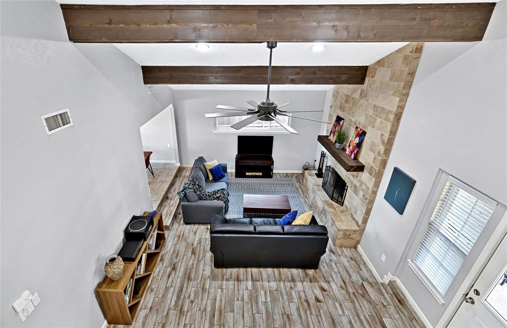 2609 Quail Ridge Irving, TX 75060 - Photo 25 of 39 a living room with furniture and a fireplace