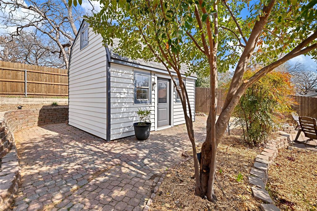 2609 Quail Ridge Irving, TX 75060 - Photo 29 of 39 a view of a small house with a tree in the background