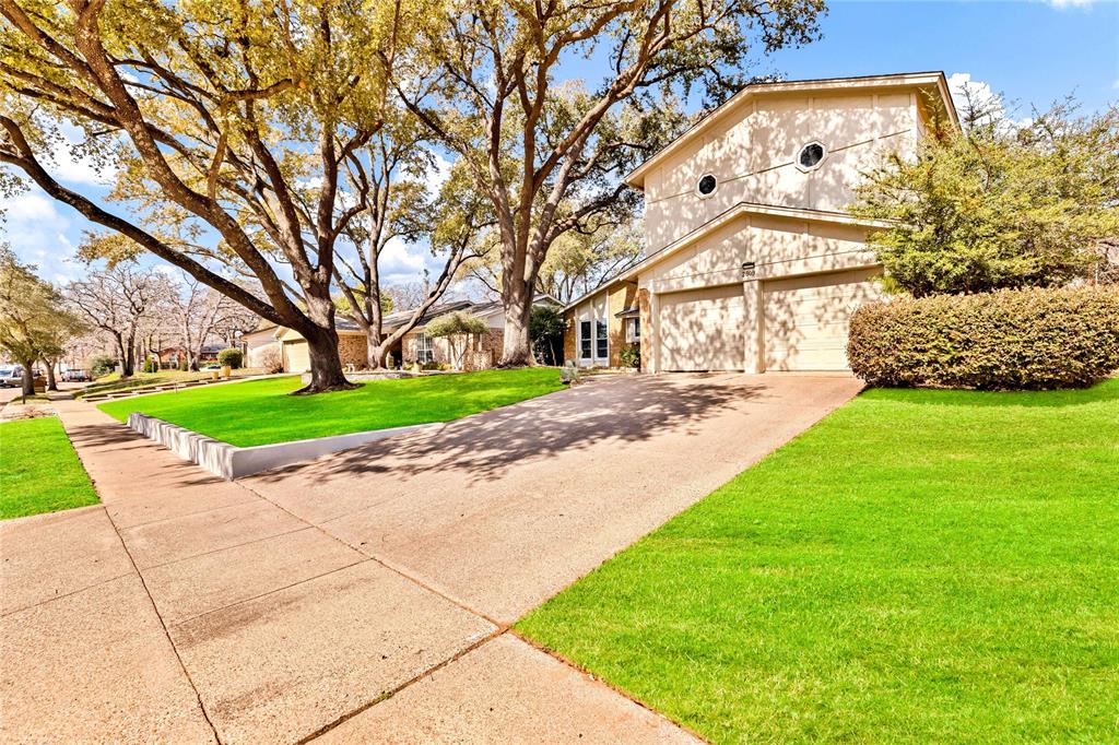 2609 Quail Ridge Irving, TX 75060 - Photo 3 of 39 a house with garden in front of it